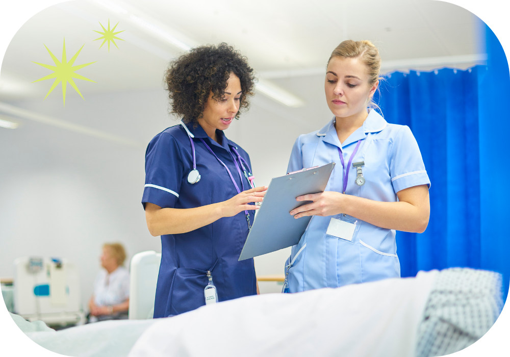 Two nurses talking beside bed Two nurses talking beside bed